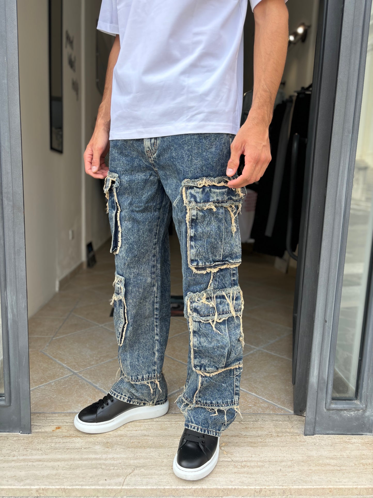 Pantalone jeans tasconi sfilacciato